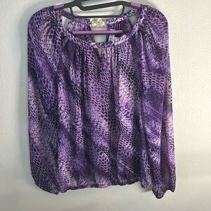 Jennifer López Snake print sheer top